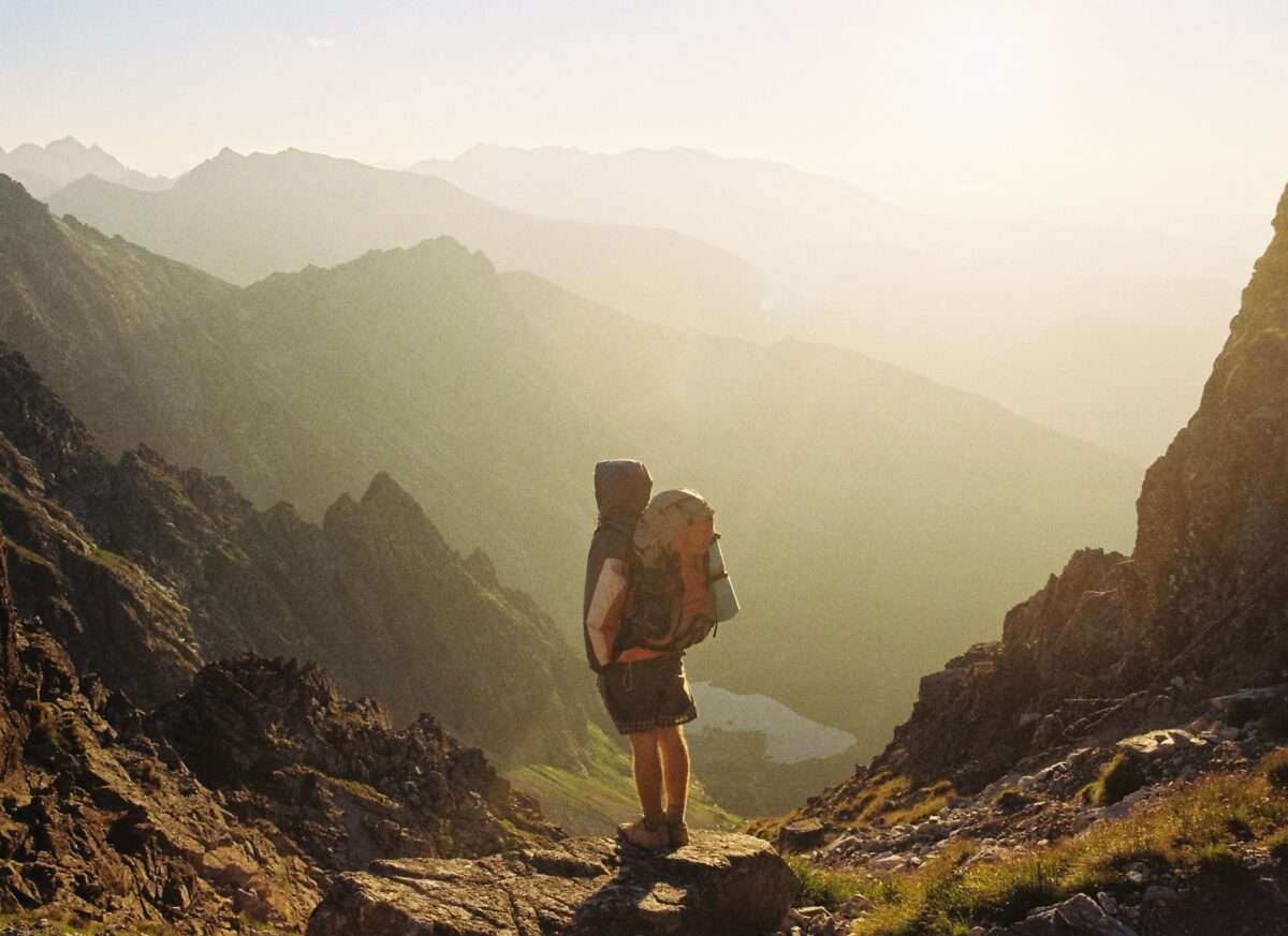 a person standing in the wild and think about tent camping on private property