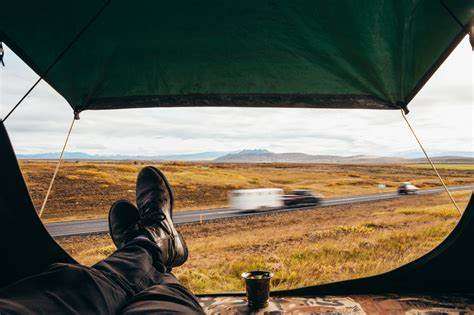 a person lying in the tent and enjoy its tent camp road trip