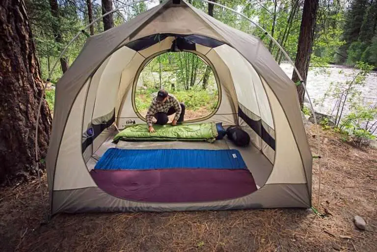 a man setup the Air Mattresses in his tent