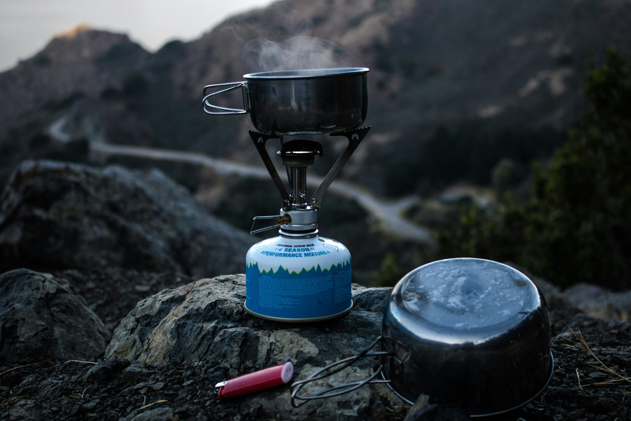 a camping stove on a rock