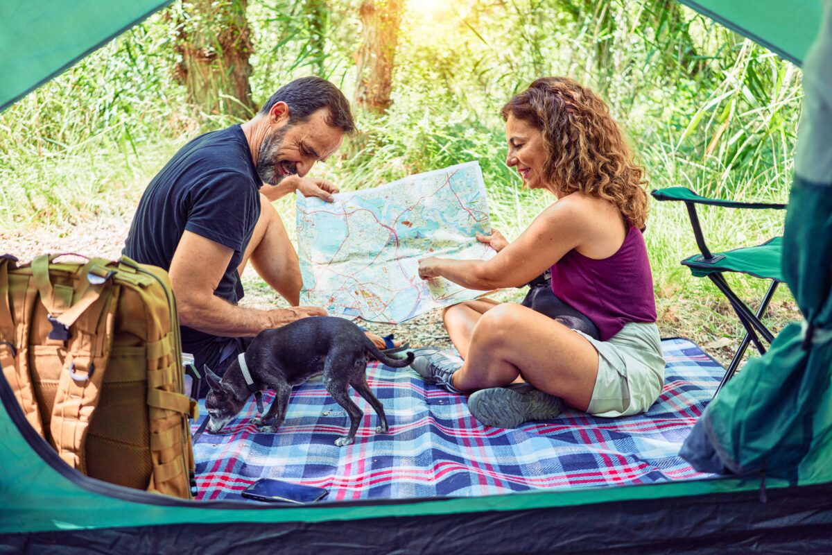 Couple sitting in front of their camp